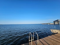 Beautiful blue waters, not sure how deep, im almost 6 foot and I didnt touch the bottom while under water, so its deep.