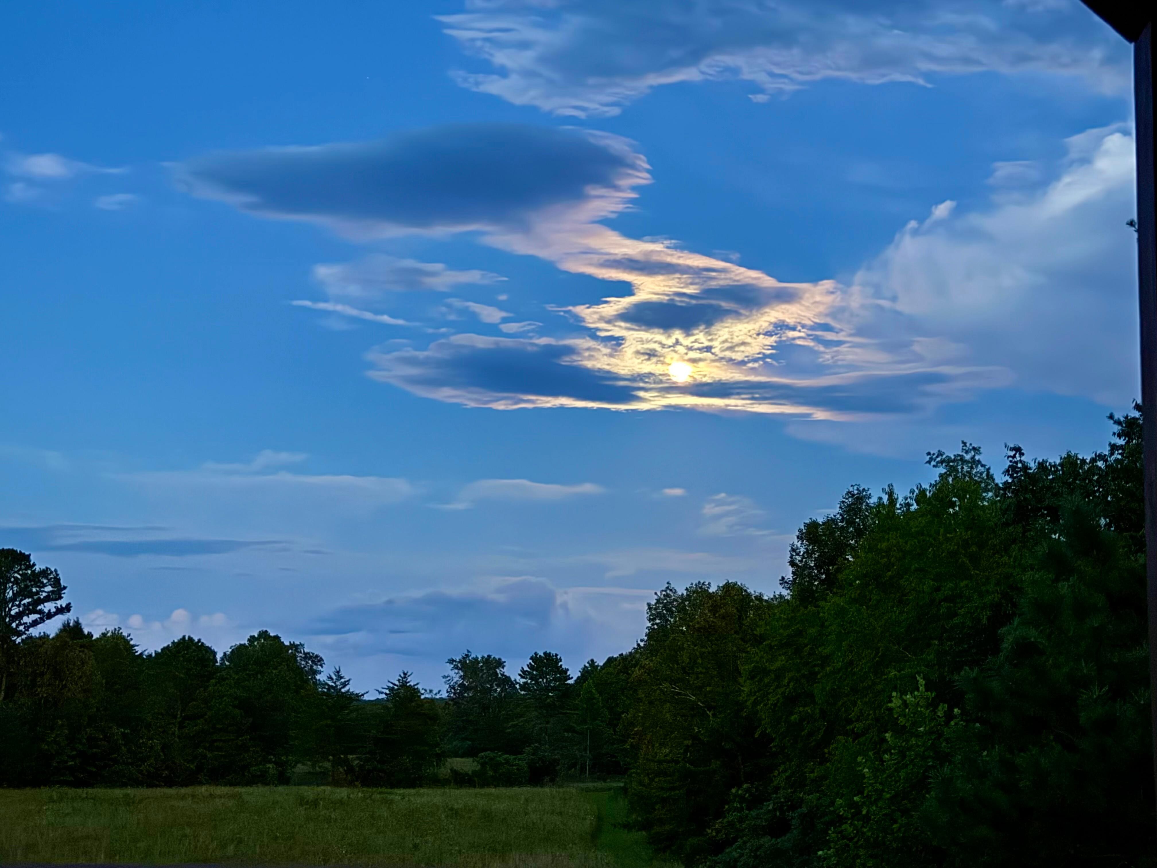 Sitting on the porch listening to thunderstorms under the full moon 