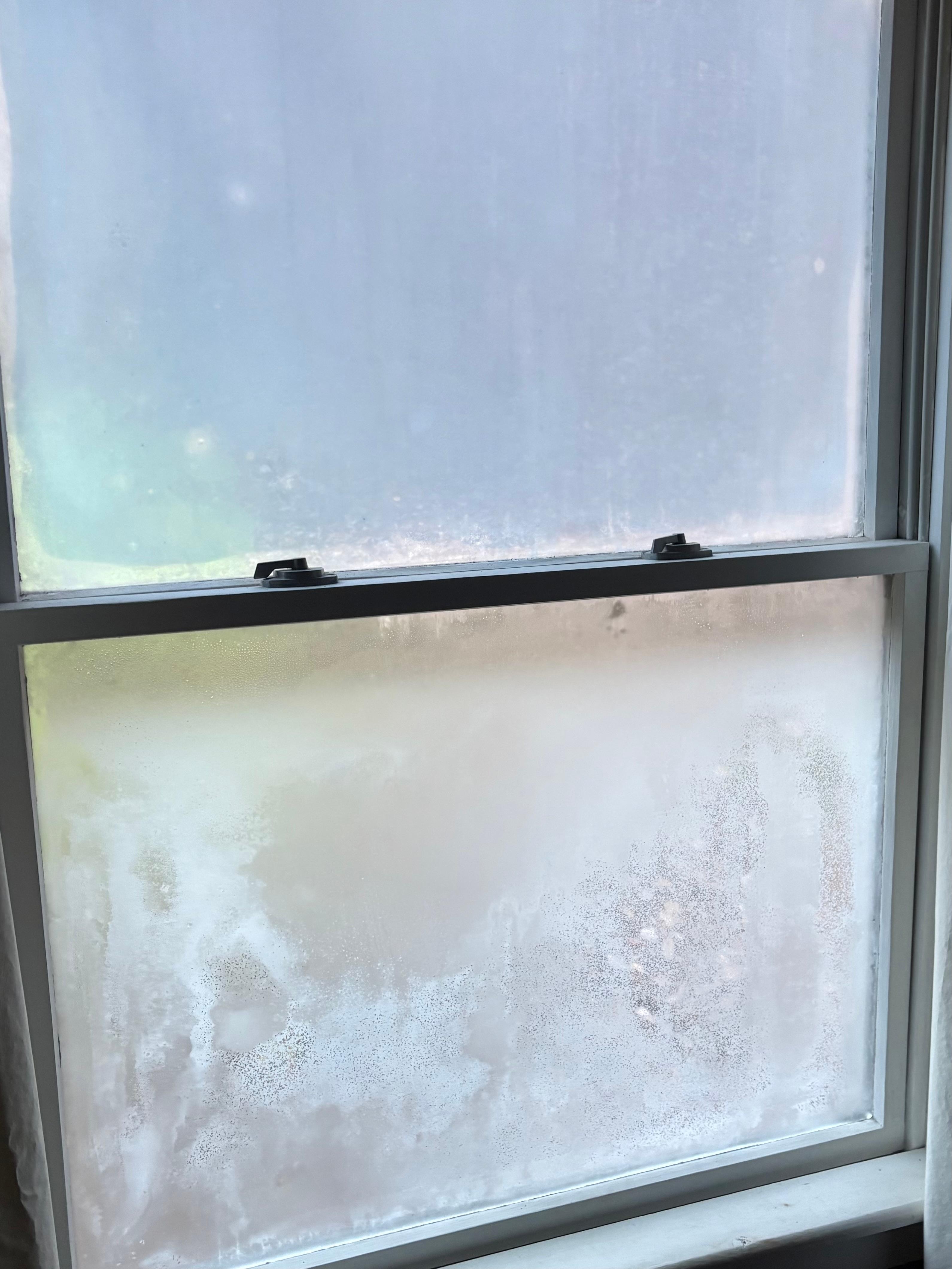 Moisture between panes of window. 