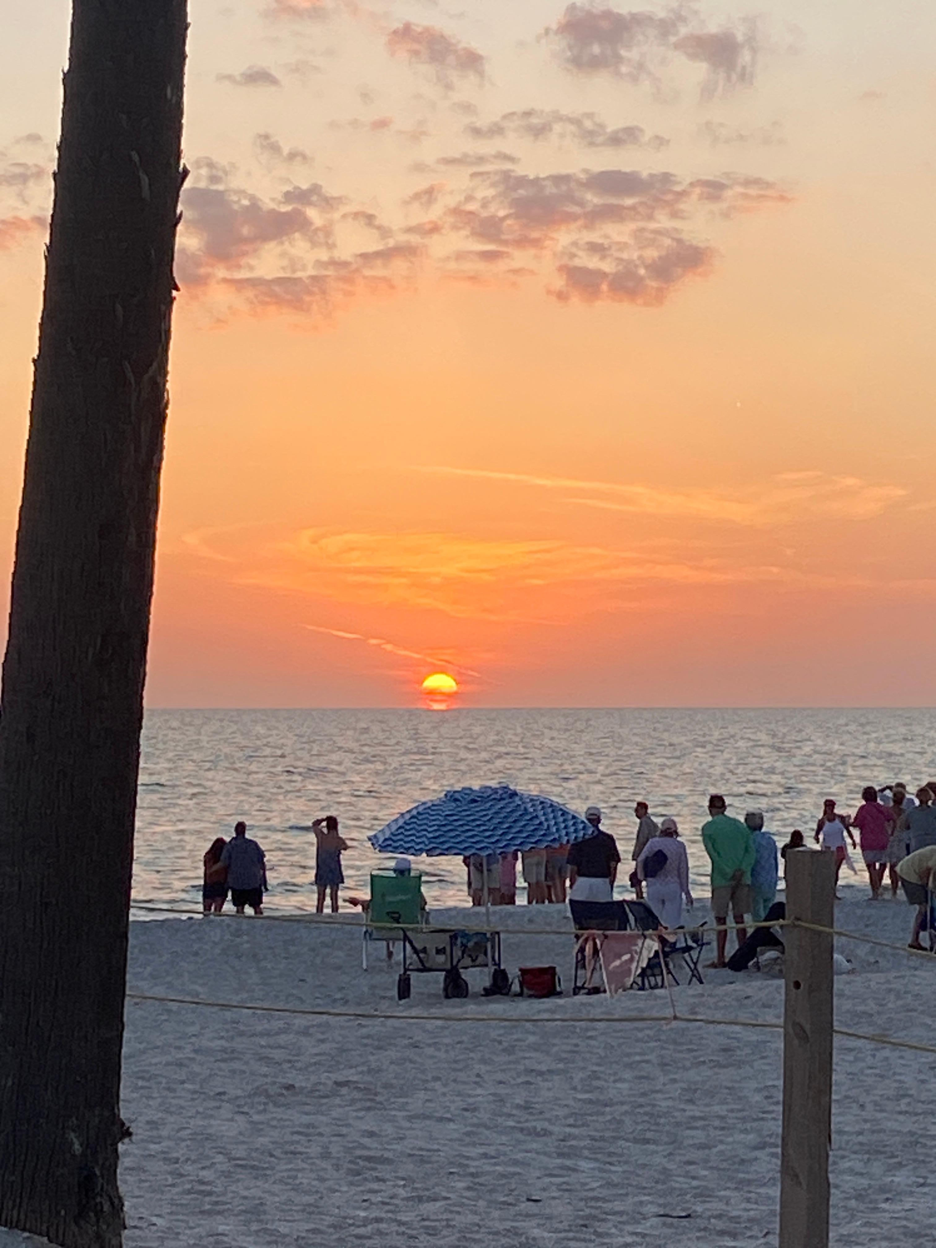 Sunset from the beach across the street from the unit.