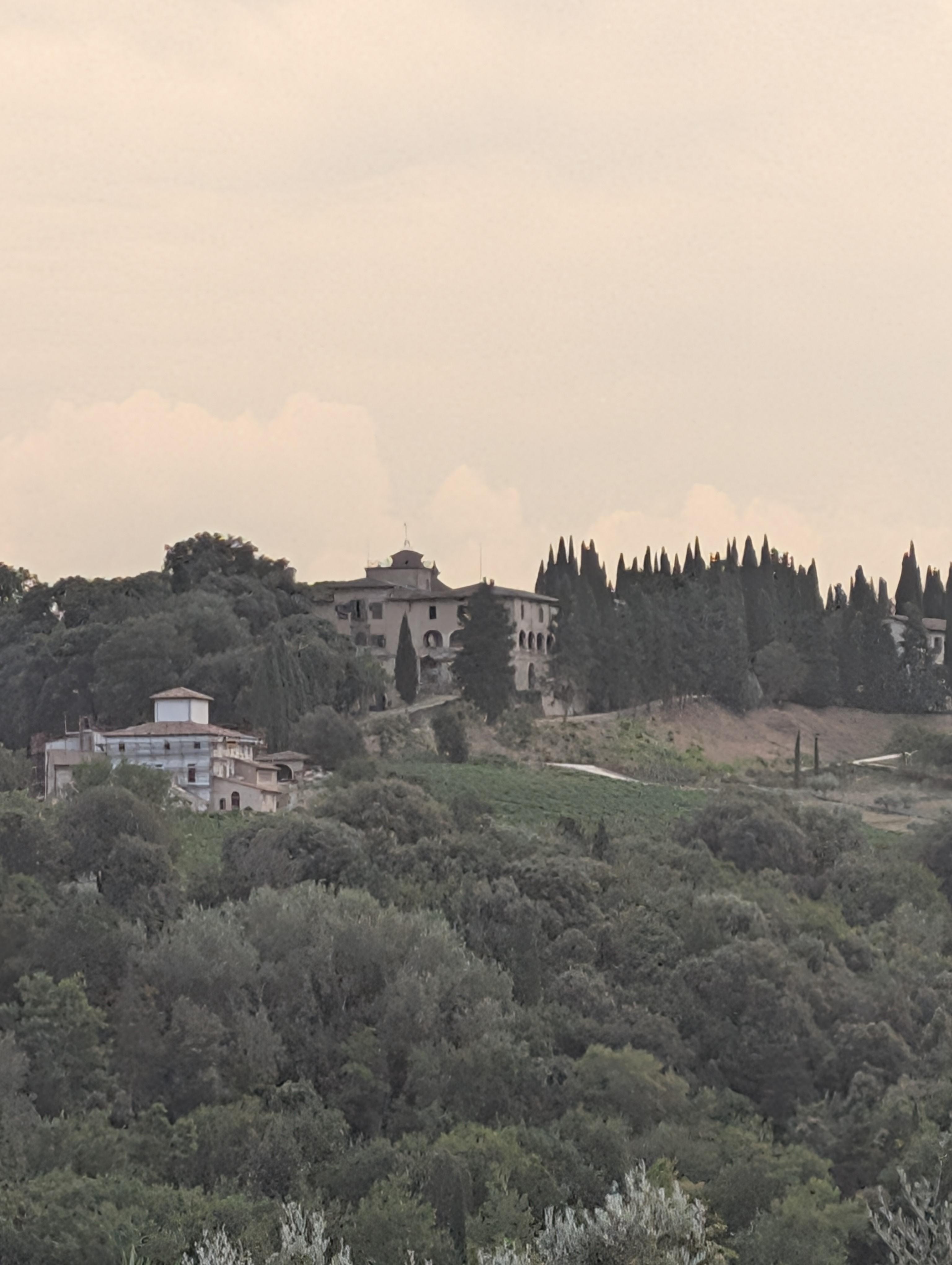 The view across from the balcony to a beautiful Tuscan mansion. 