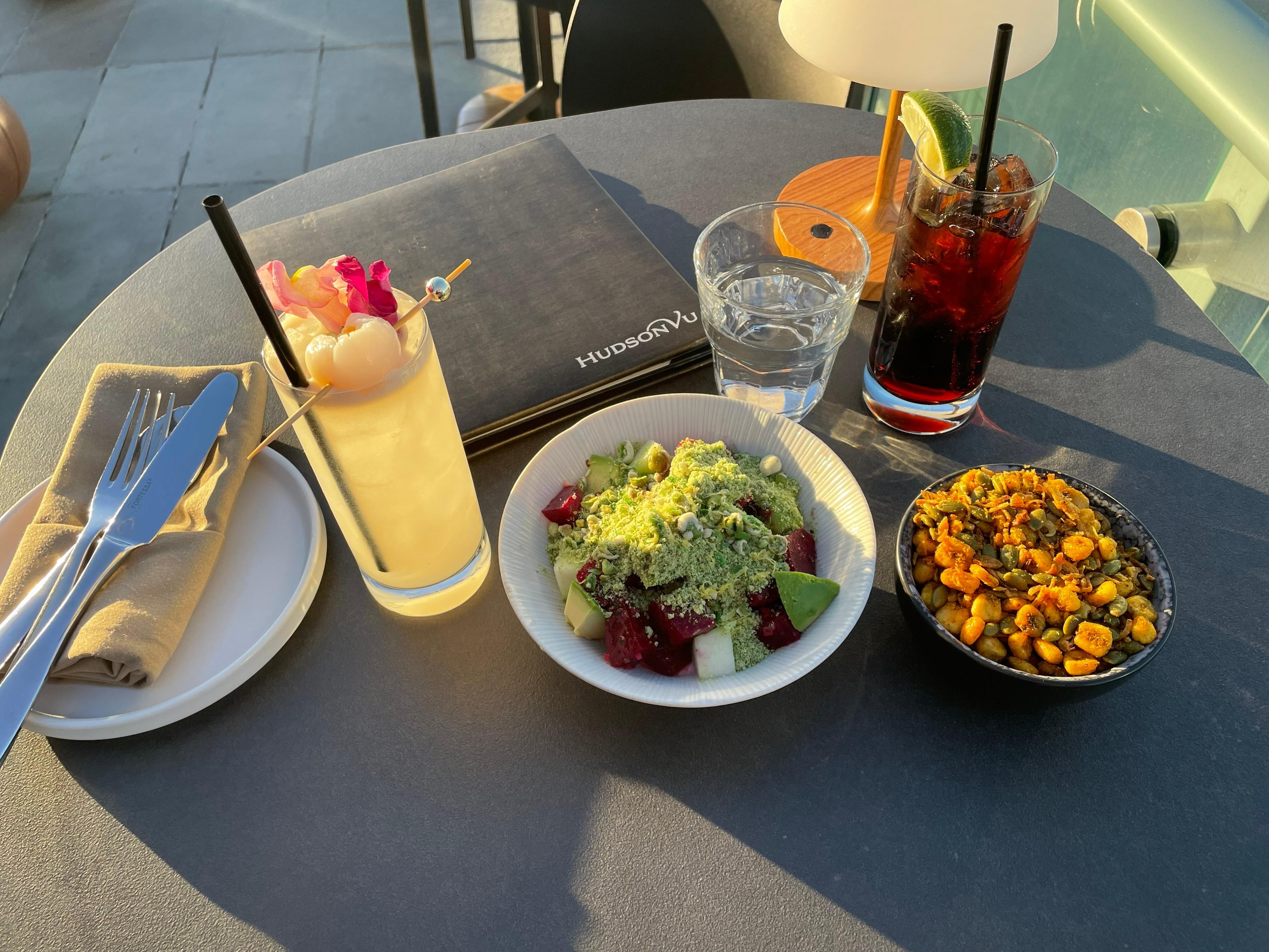 Beet Salad, Cherry Pepsi, Water, bar bites and a cocktail for sunset