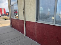 Screen & paint damage at the front of the hotel