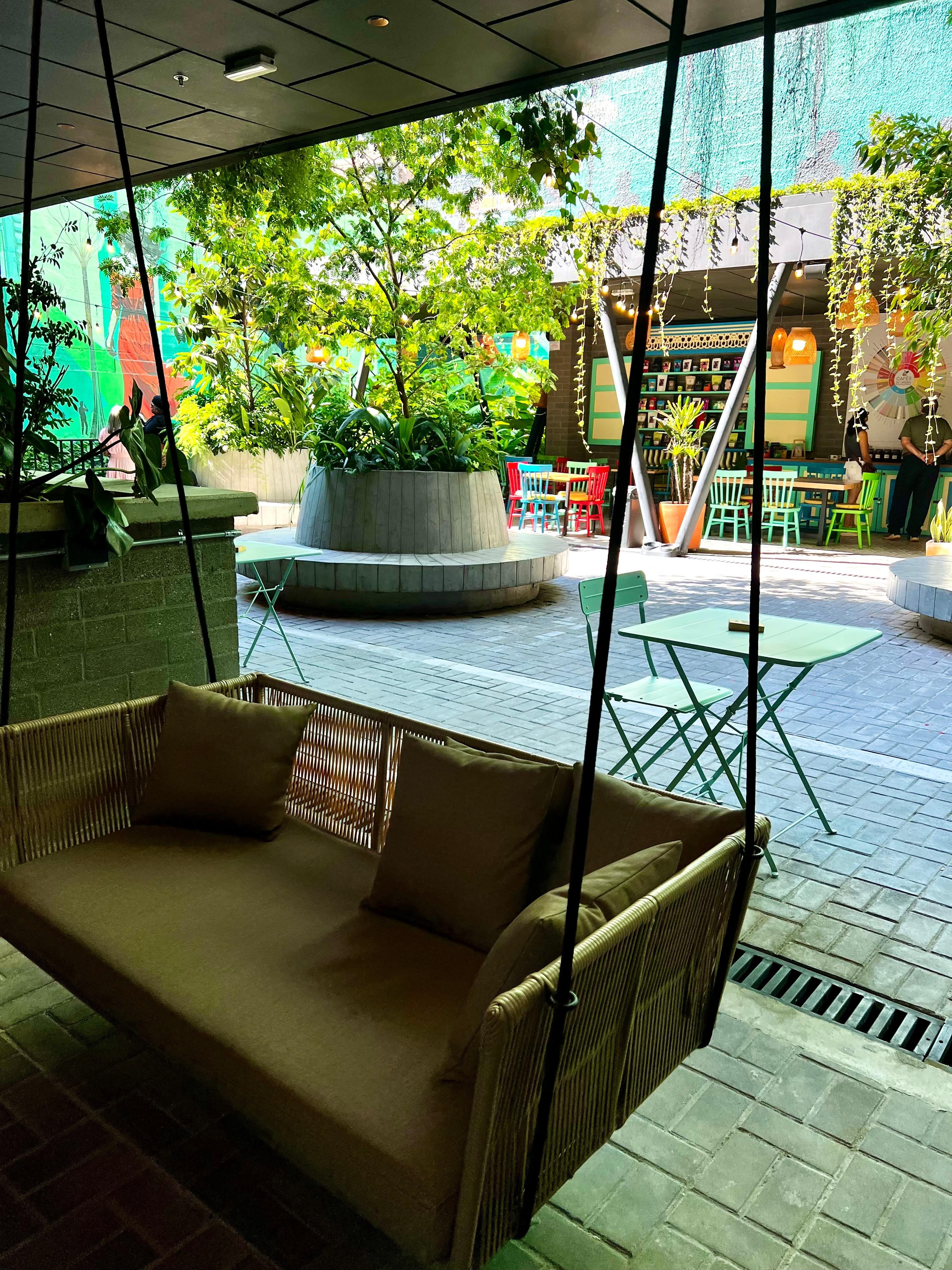 Small coffee shop at an internal patio just outside the lobby. 