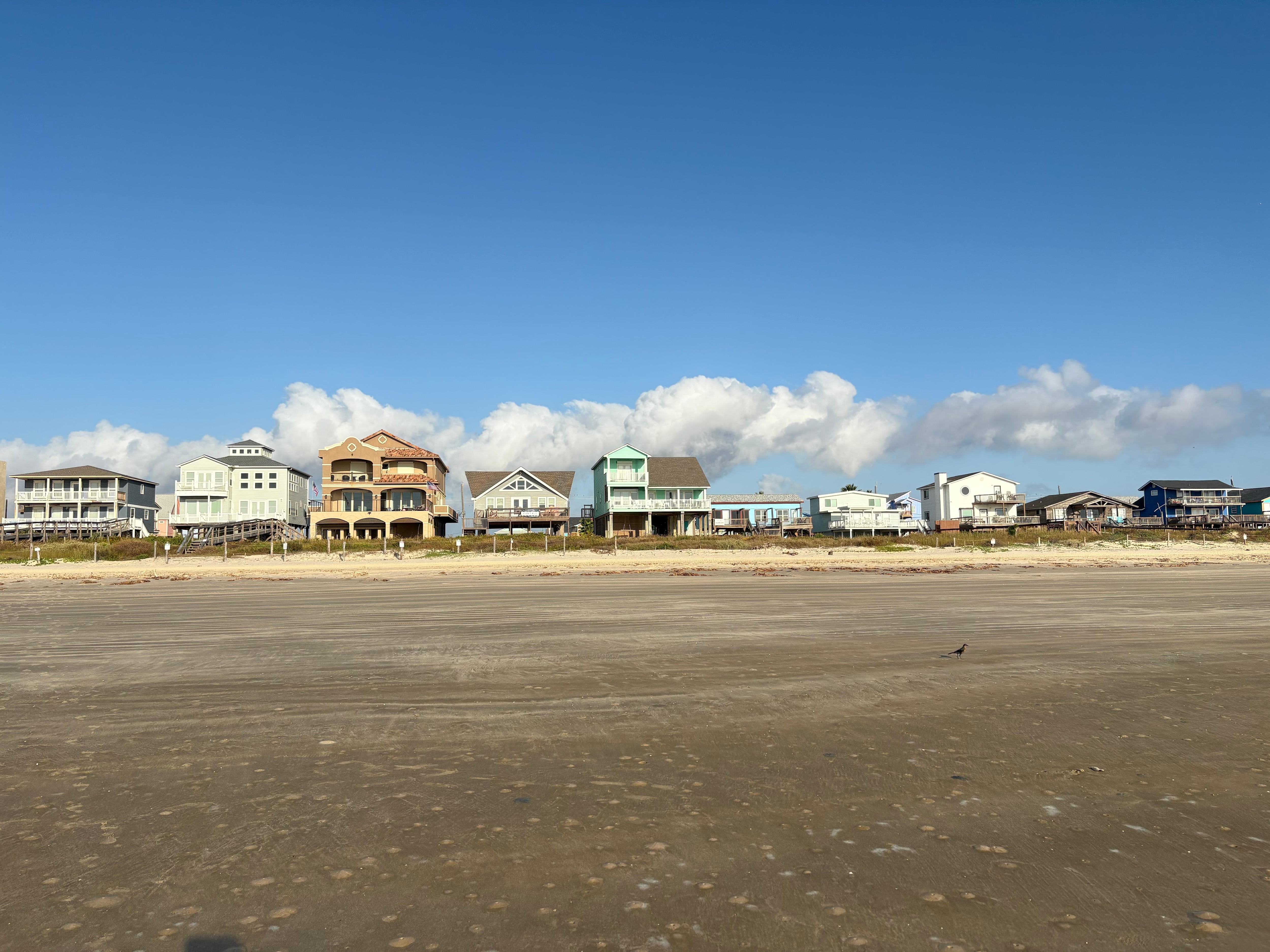 A shot of the house from walking on the beach.