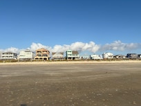 A shot of the house from walking on the beach.