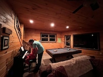 Granddaddy teaching Granddaughter how to play