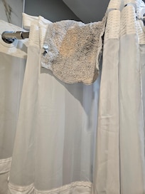 Dirty washcloth cloth in shower.