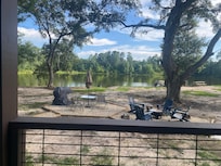 Fire pit and grill area next to the pond.