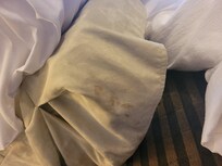 Red/brown stain on the dust ruffle