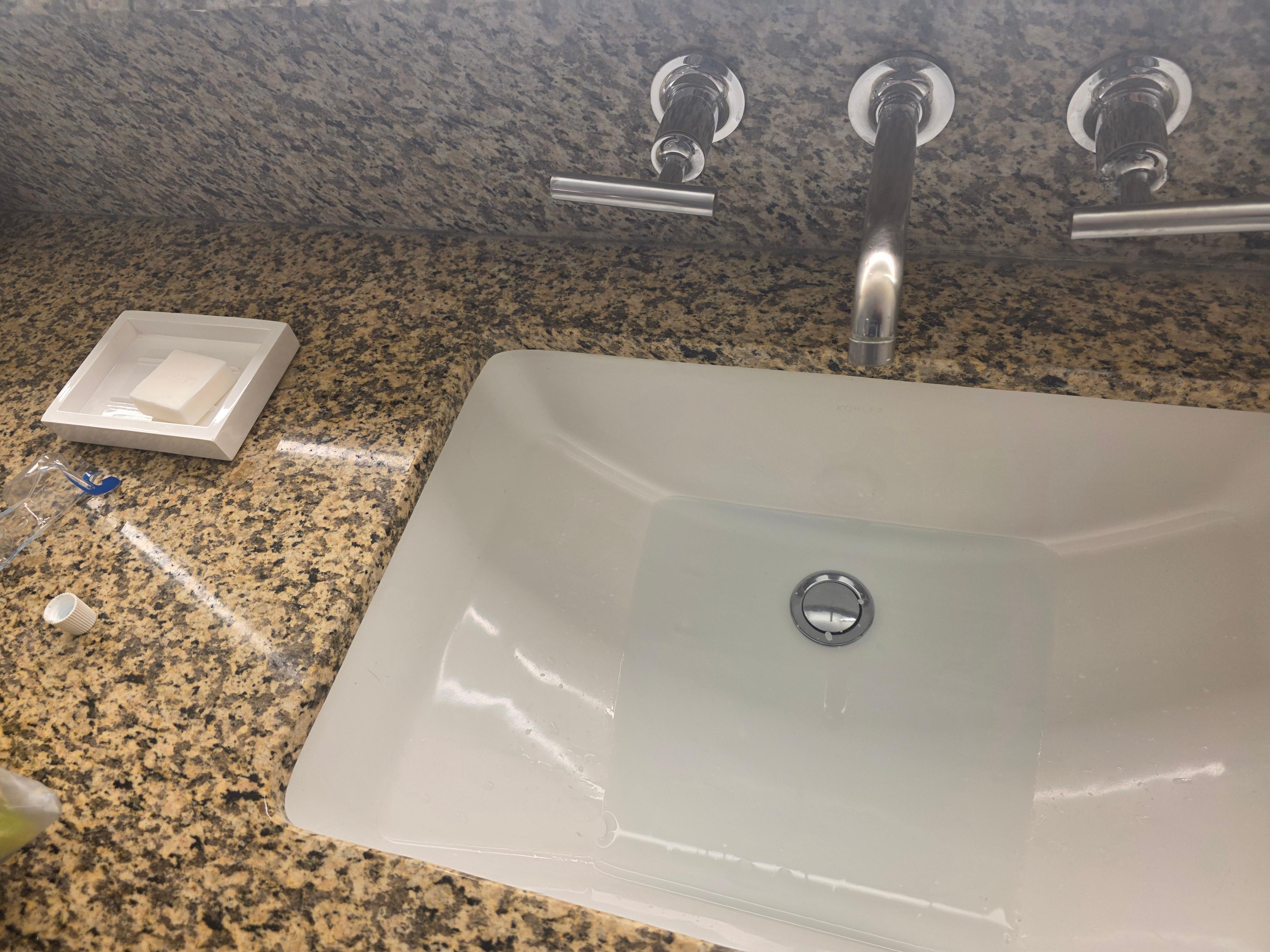 Not even under the sink is there a valve to open the sink drain.