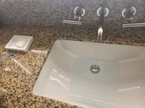 Not even under the sink is there a valve to open the sink drain.