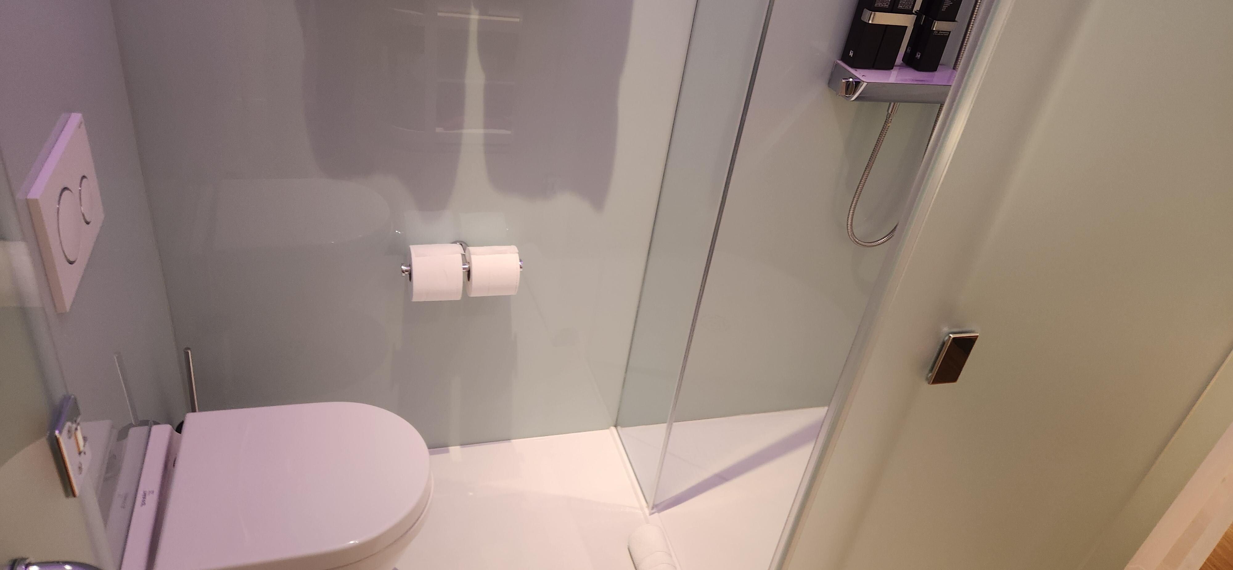 Really clean bathroom. People in room can watch you take a poop through translucent glass. Creepy!