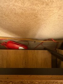 Dirt under bedside table.