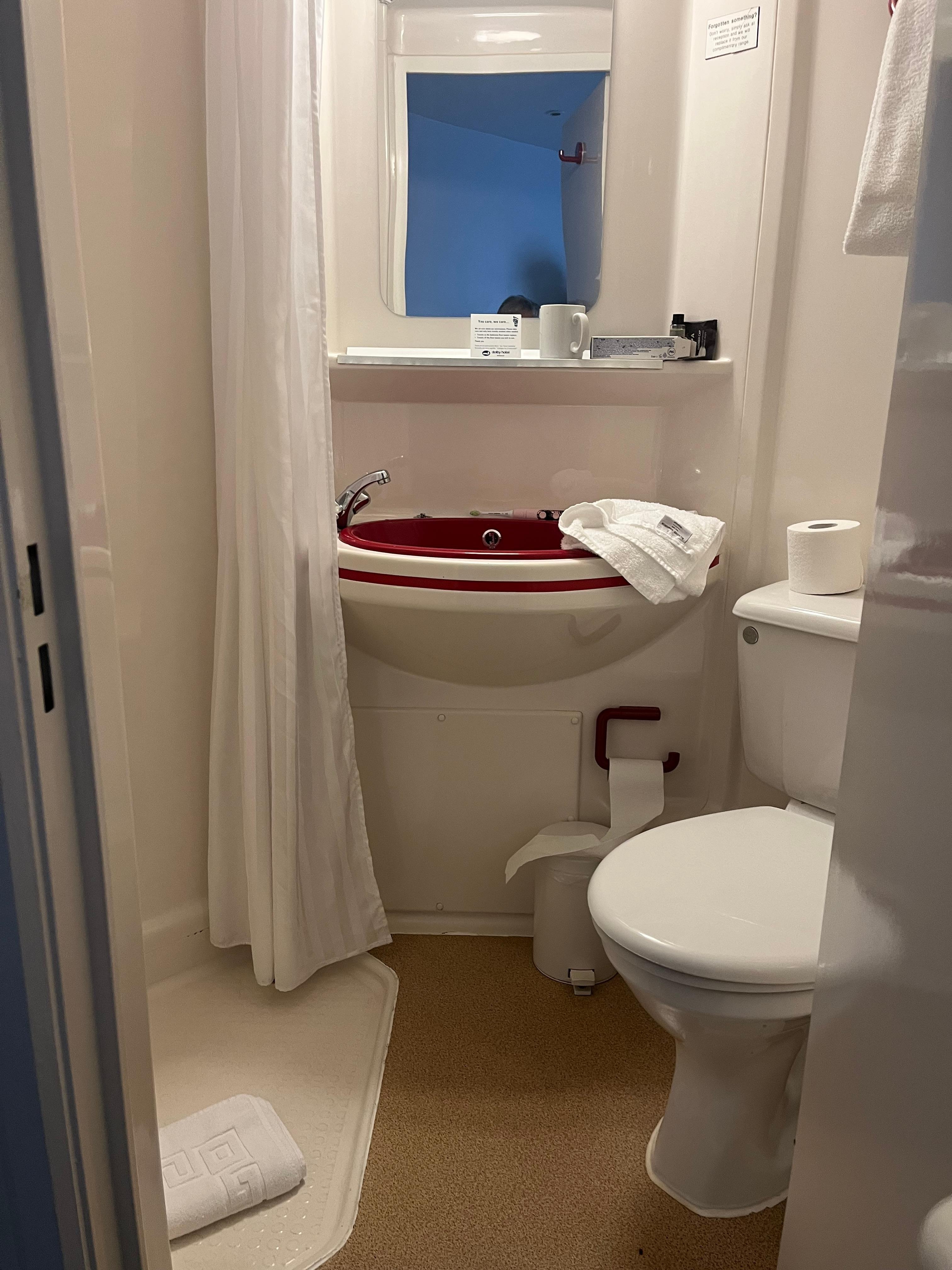 Bathroom was functional but dated and very small . Just enough room to turn round in. 