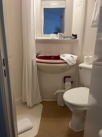 Bathroom was functional but dated and very small . Just enough room to turn round in.