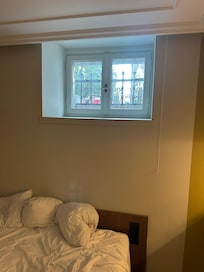 Basement window with bars — no emergency exit