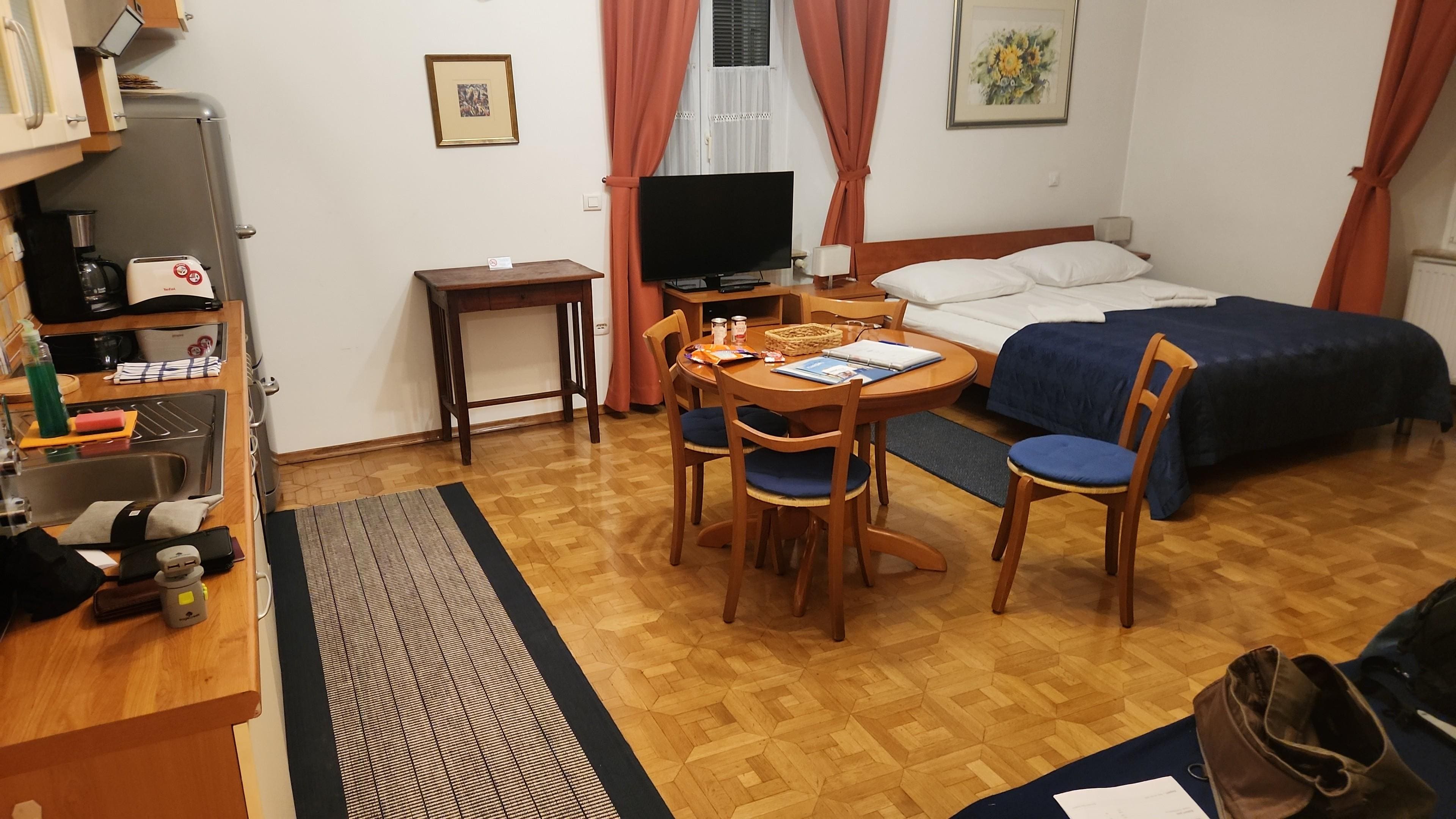 The main room is at it's described. The washing machine is in a cupboard next to the sink. The shower was the only surprise- it's very small!