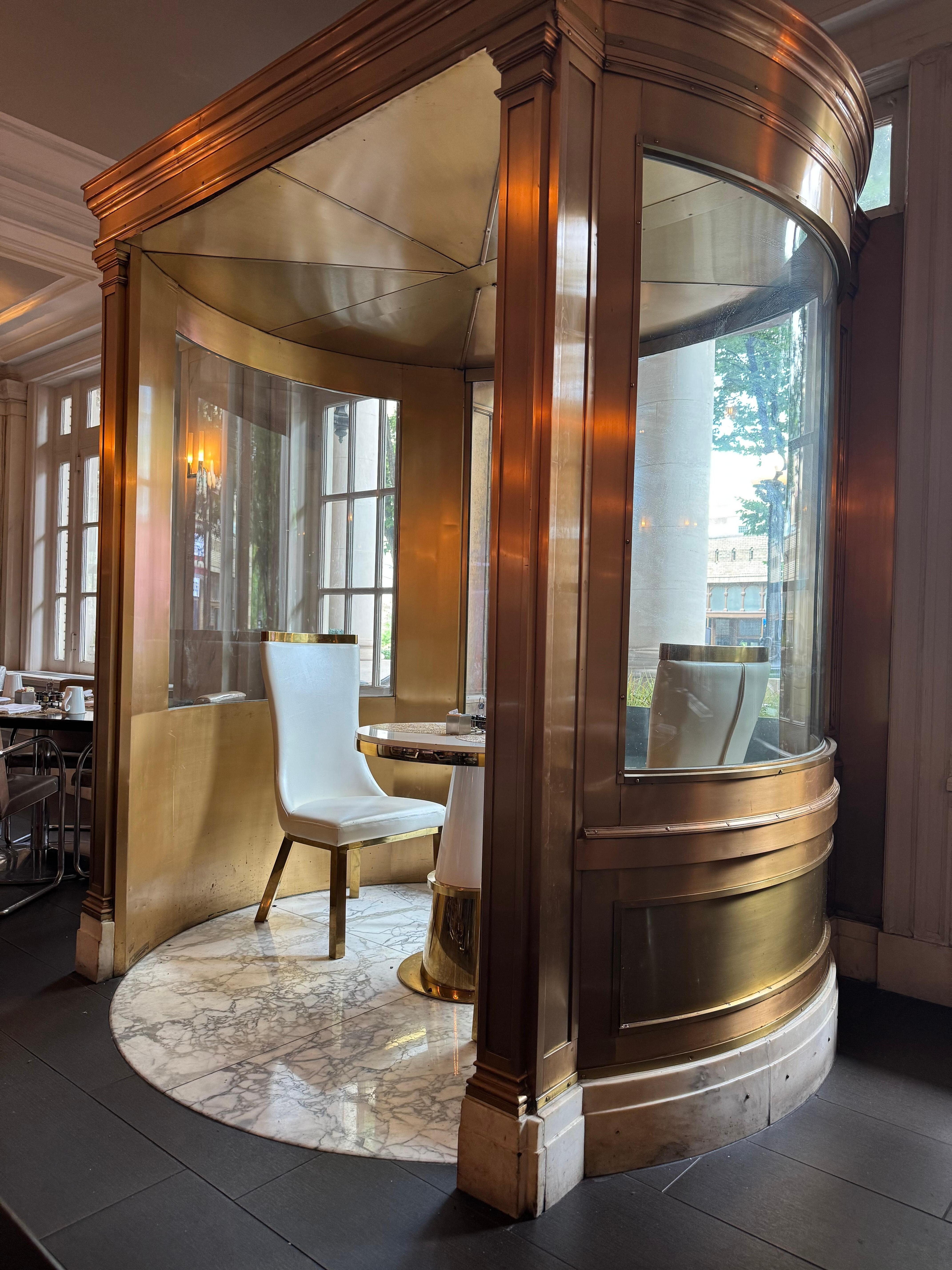 Breakfast nook. Looks like was an old revolving door once.