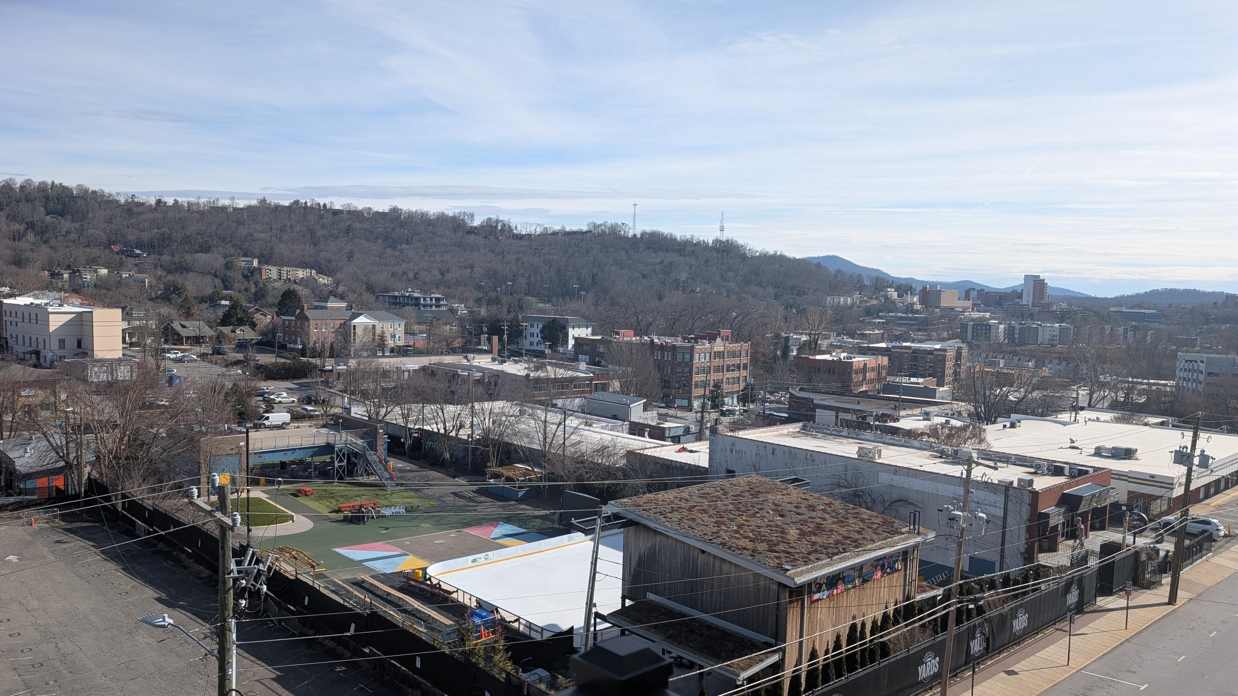 Balcony view overlooking Asheville Brewery across the street with winter ice rink set-up