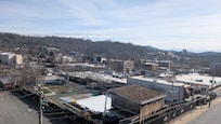 Balcony view overlooking Asheville Brewery across the street with winter ice rink set-up