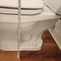 Toliet sits very low to the floor. Toliet water depth is shallow.
