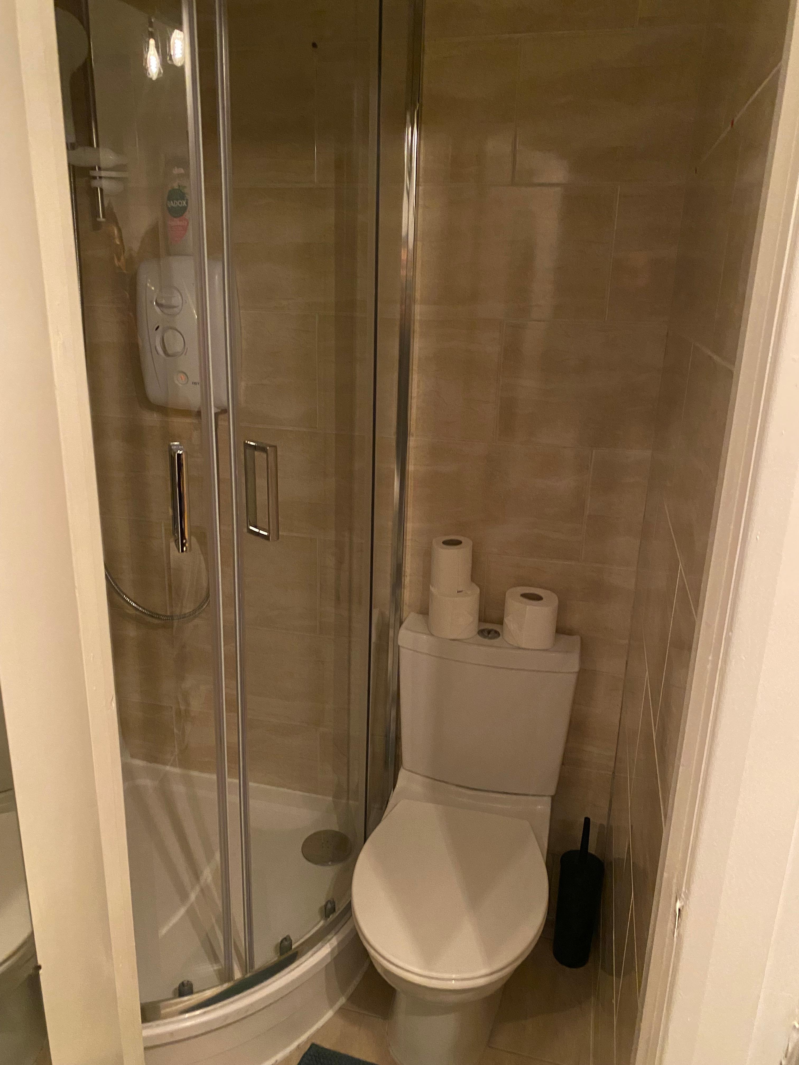 Bathroom with no sink to wash hands or brush teeth. 