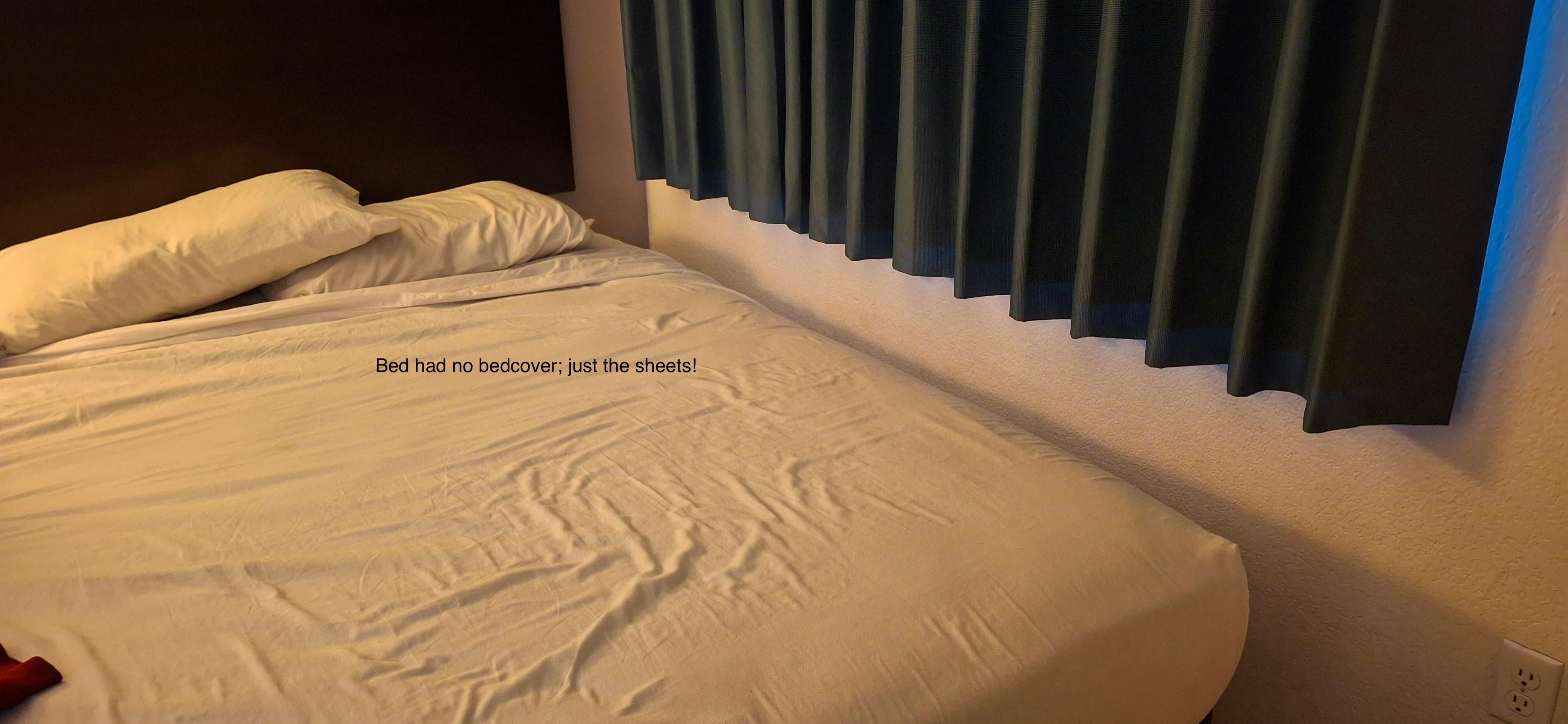 The bed in this room only had bedsheets. No cover (i.e., bedspread).