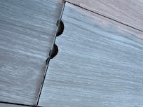 Cheap flooring peeling up, marred