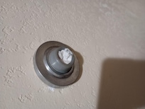 Something shoved in the door stop.