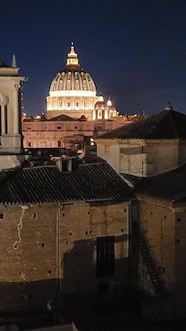 View of St. Peter's dome at night from the balcony.