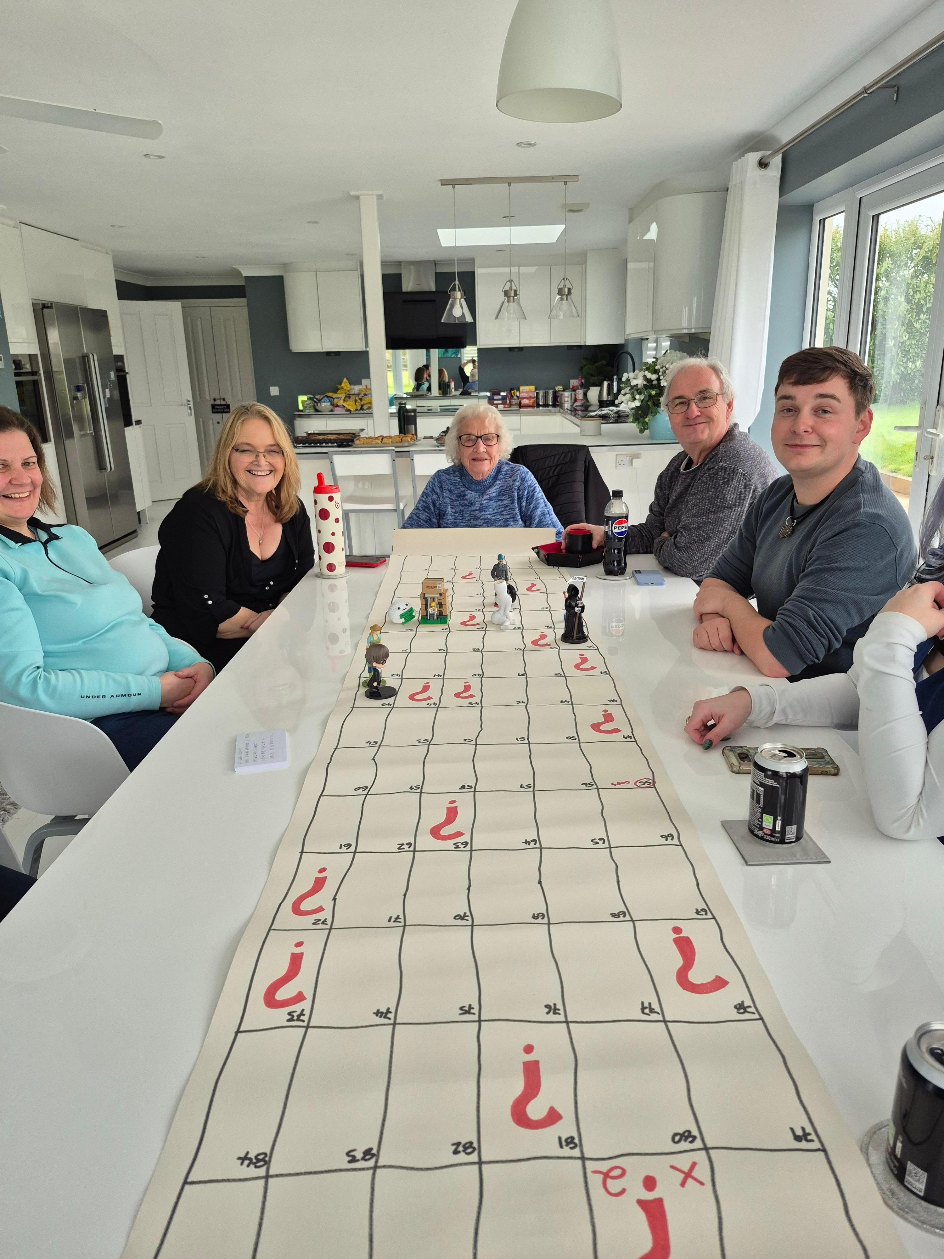 Playing games in the open plan kitchen, diner, sofa area...