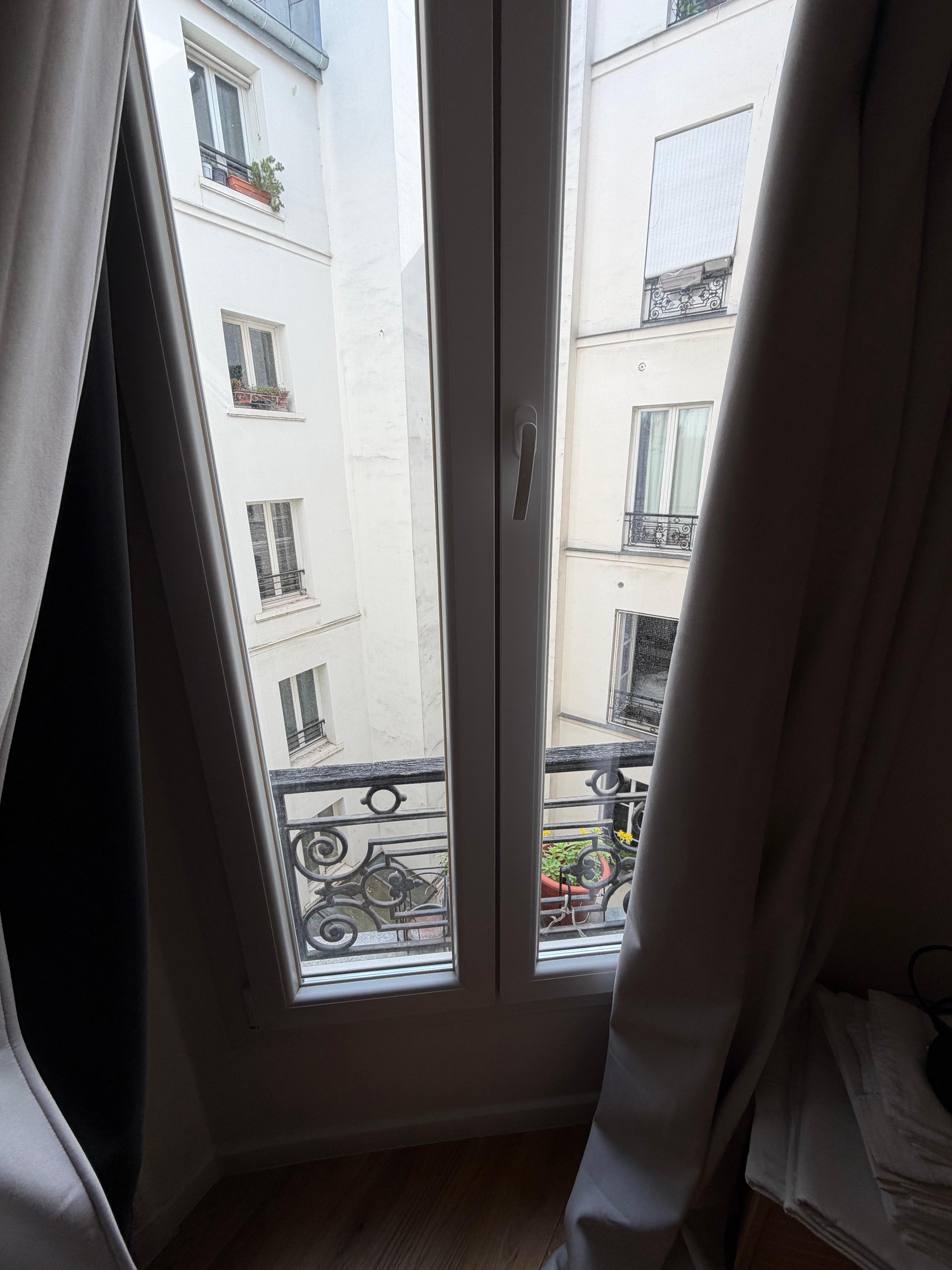 View from windows is not to the street but to an interior  space looking toward other apts in the building 