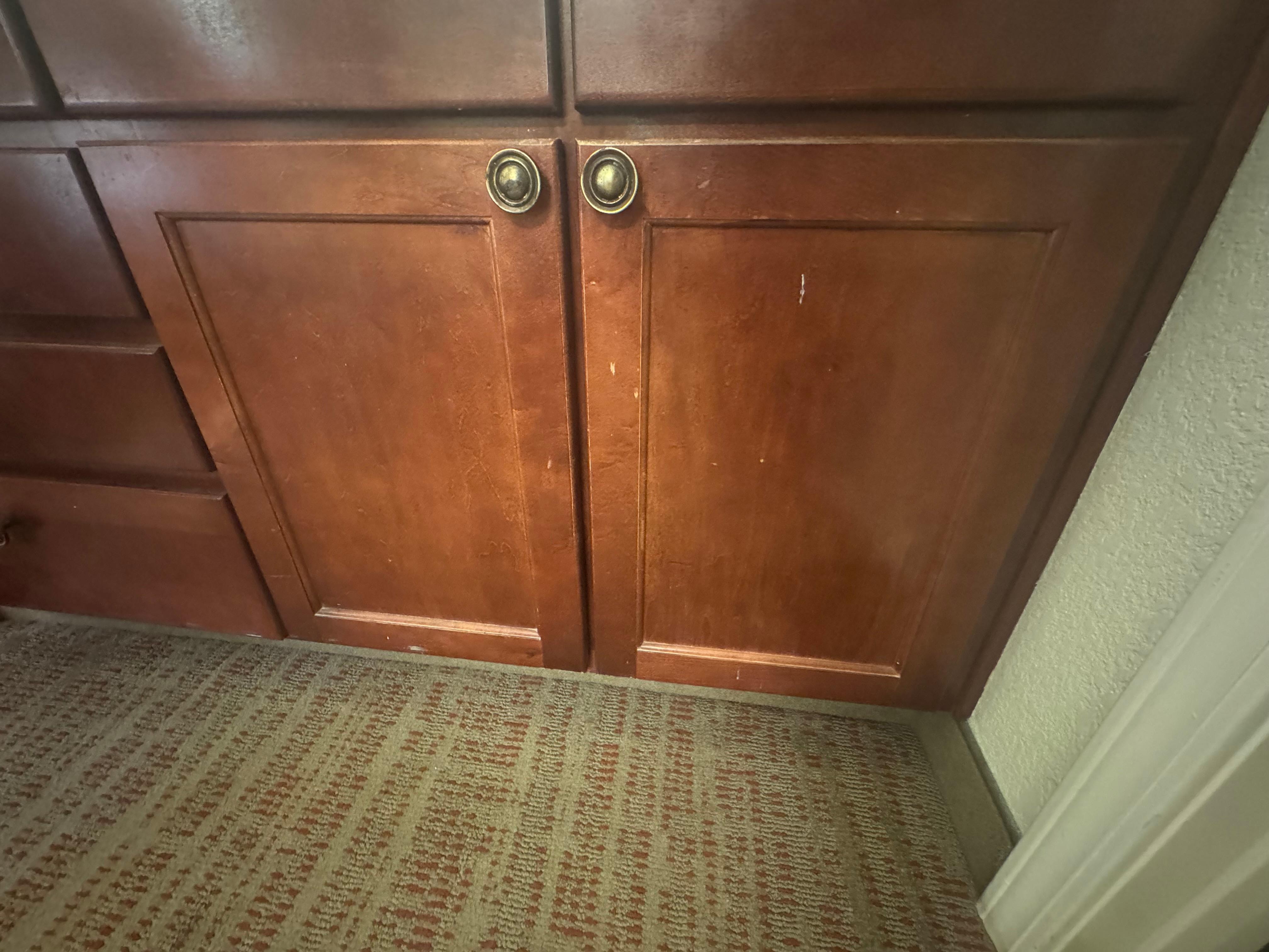 Worn out and filth on cabinet. 