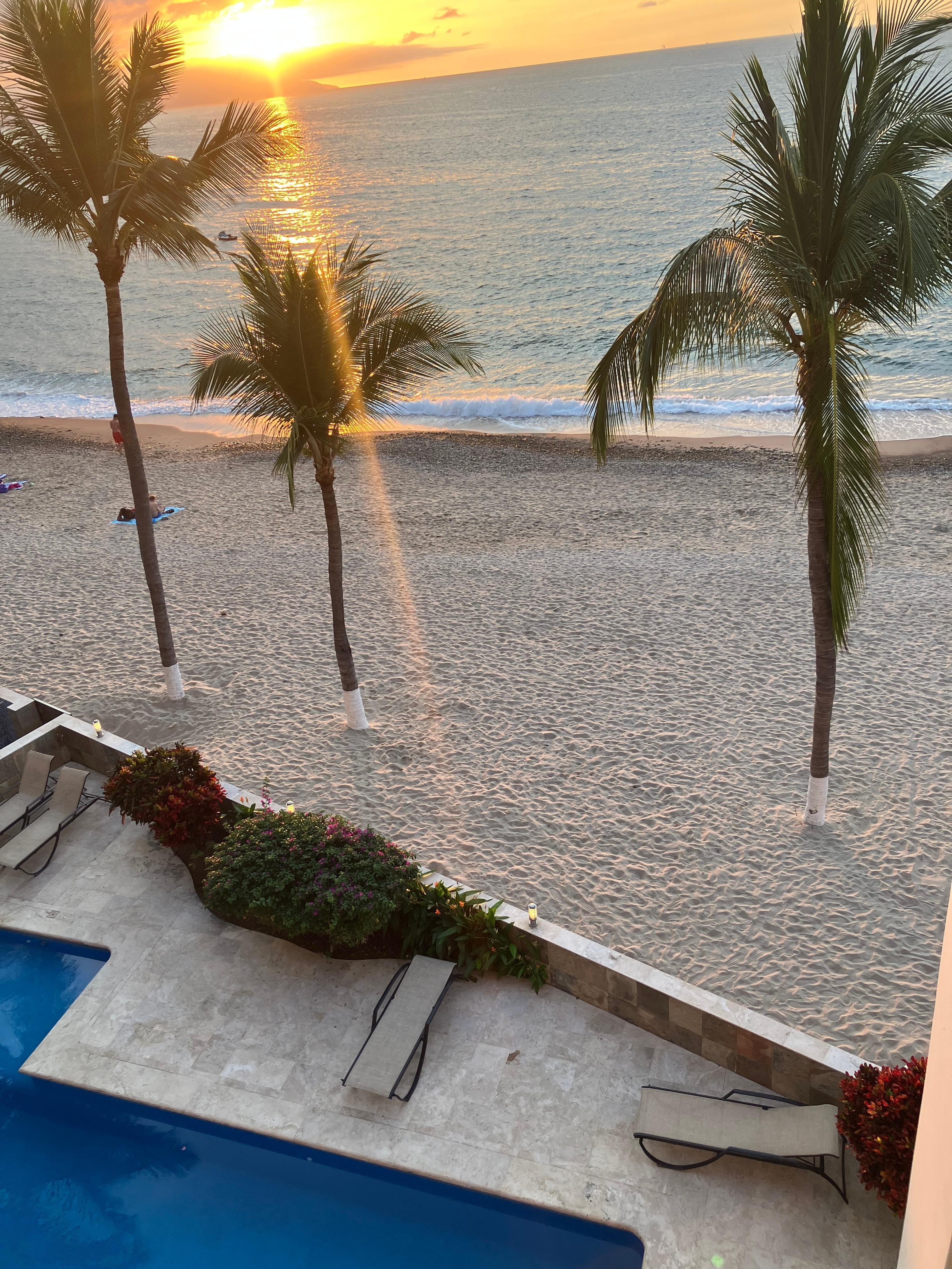 View of beach and swimming pool from main balcony