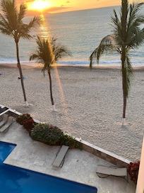 View of beach and swimming pool from main balcony