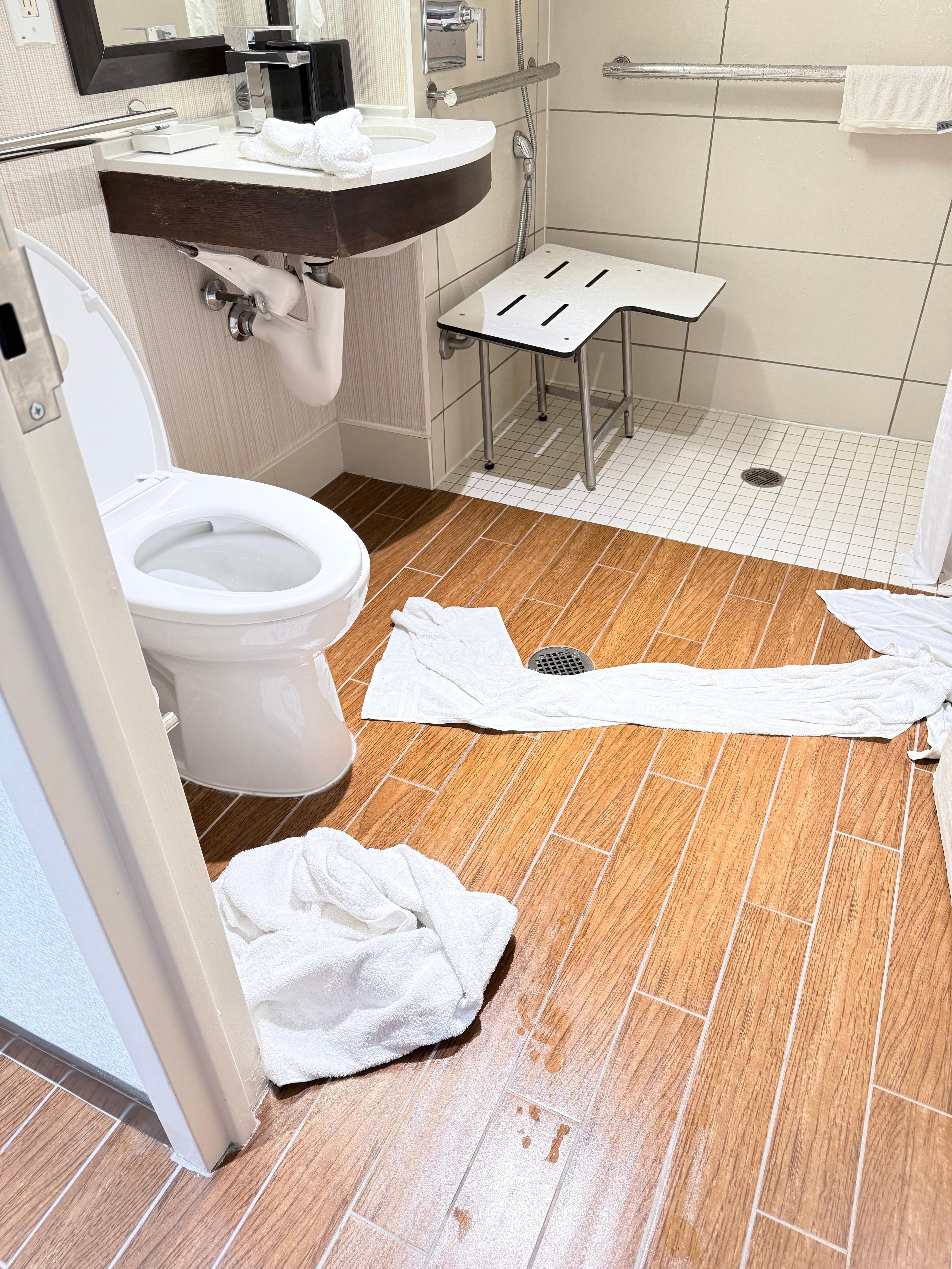 How far the water seeps across the bathroom floor.