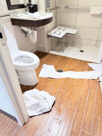 How far the water seeps across the bathroom floor.