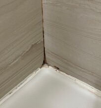 Corner of shower pan