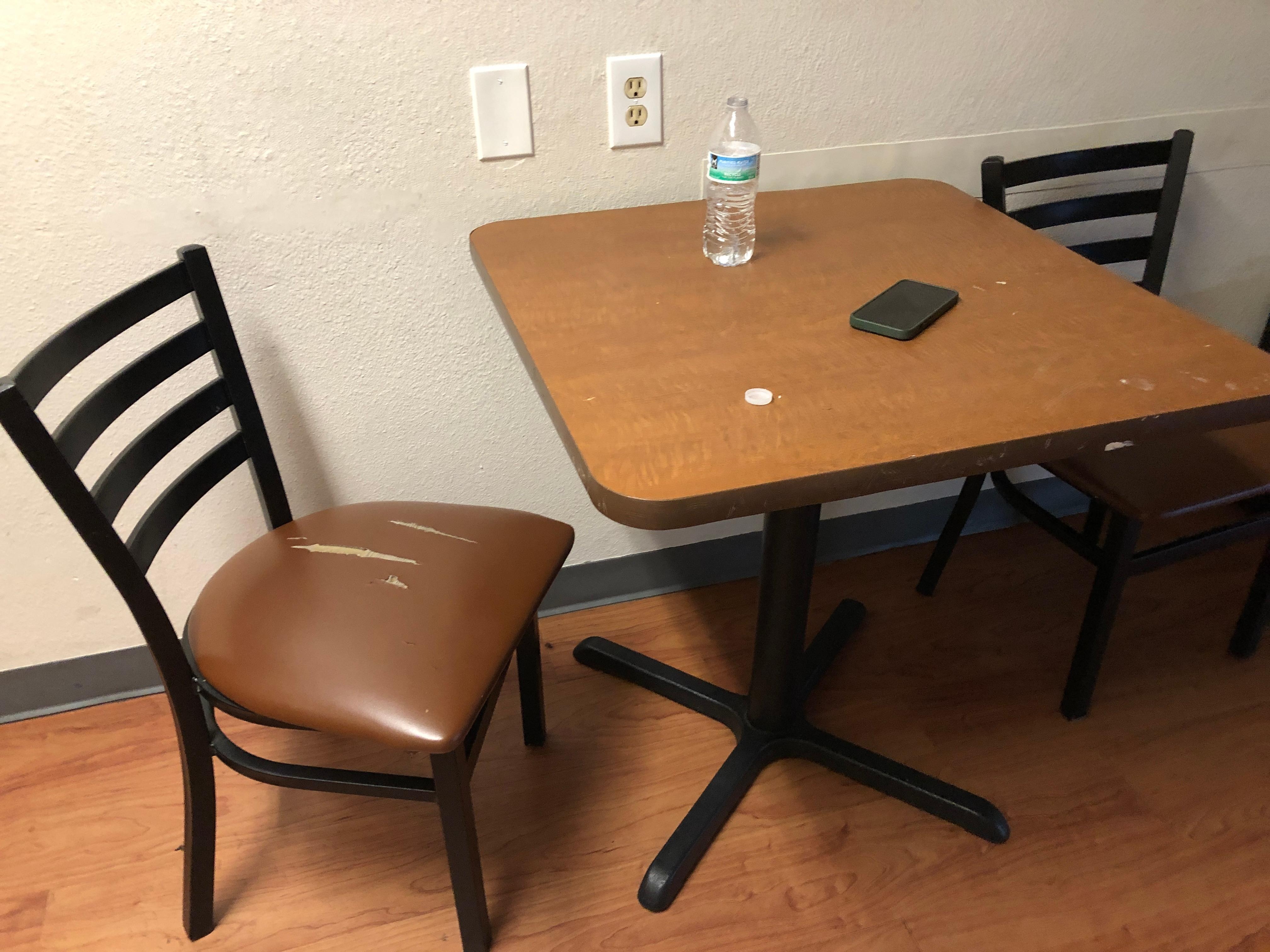 Substance on table and rips in chairs (only 2 for a reservation of 4)