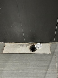 One of the bathroom's drain