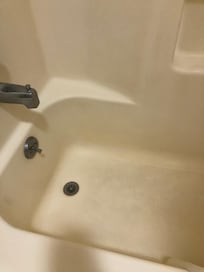 Dirty bathtub with hair