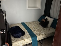 I think this is supposed to be the bedroom they show with the blue blanket