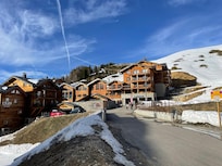 Sits on its own piste accessed by a bridge