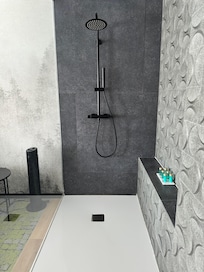 Large walk-in shower was in the bedroom. Base very slippery.