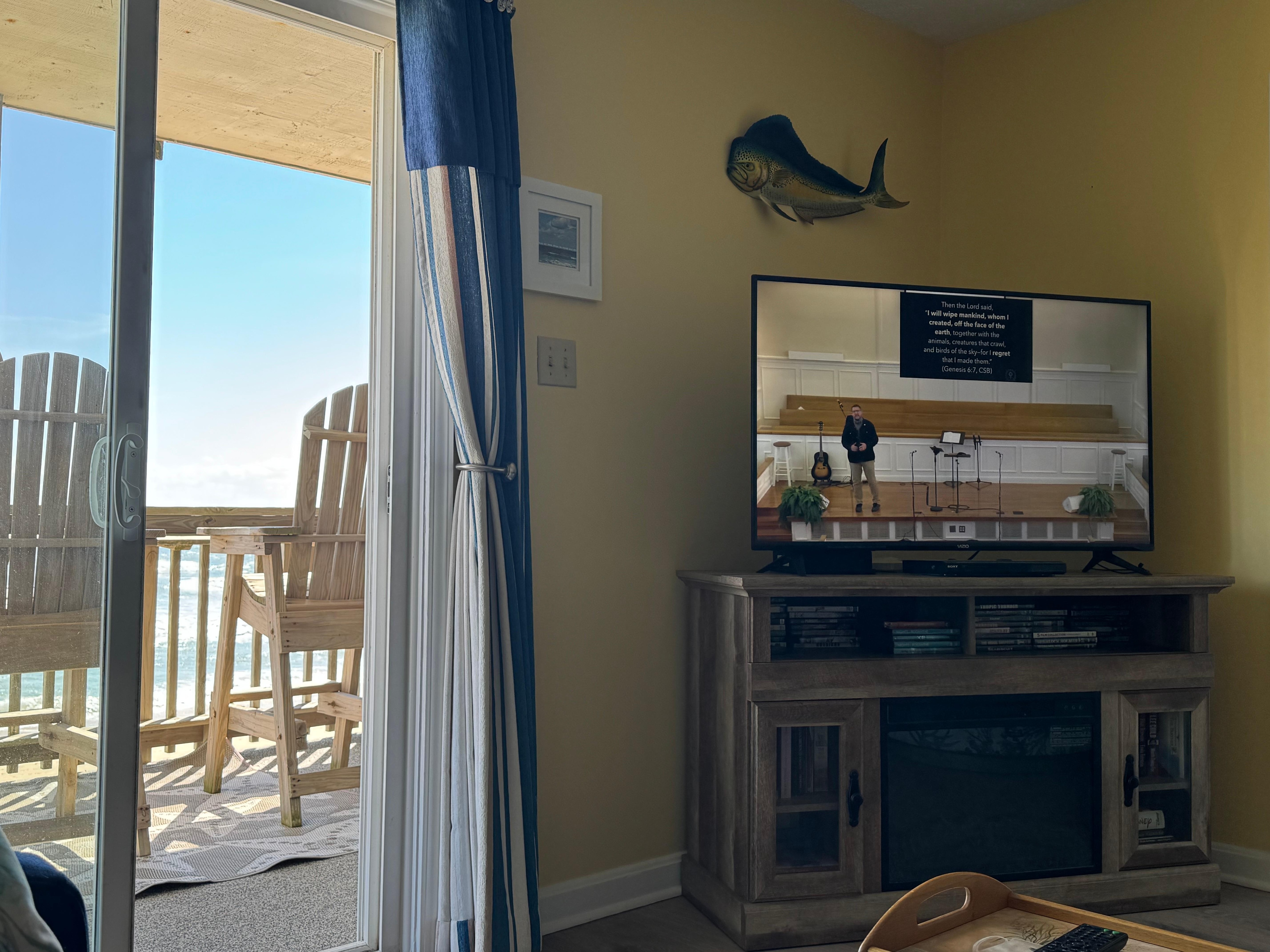 Watching our church service while listening to the waves