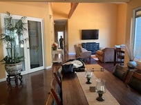 Big harvest table and another one on the patio.