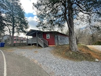 Exterior of cabin with driveway.
