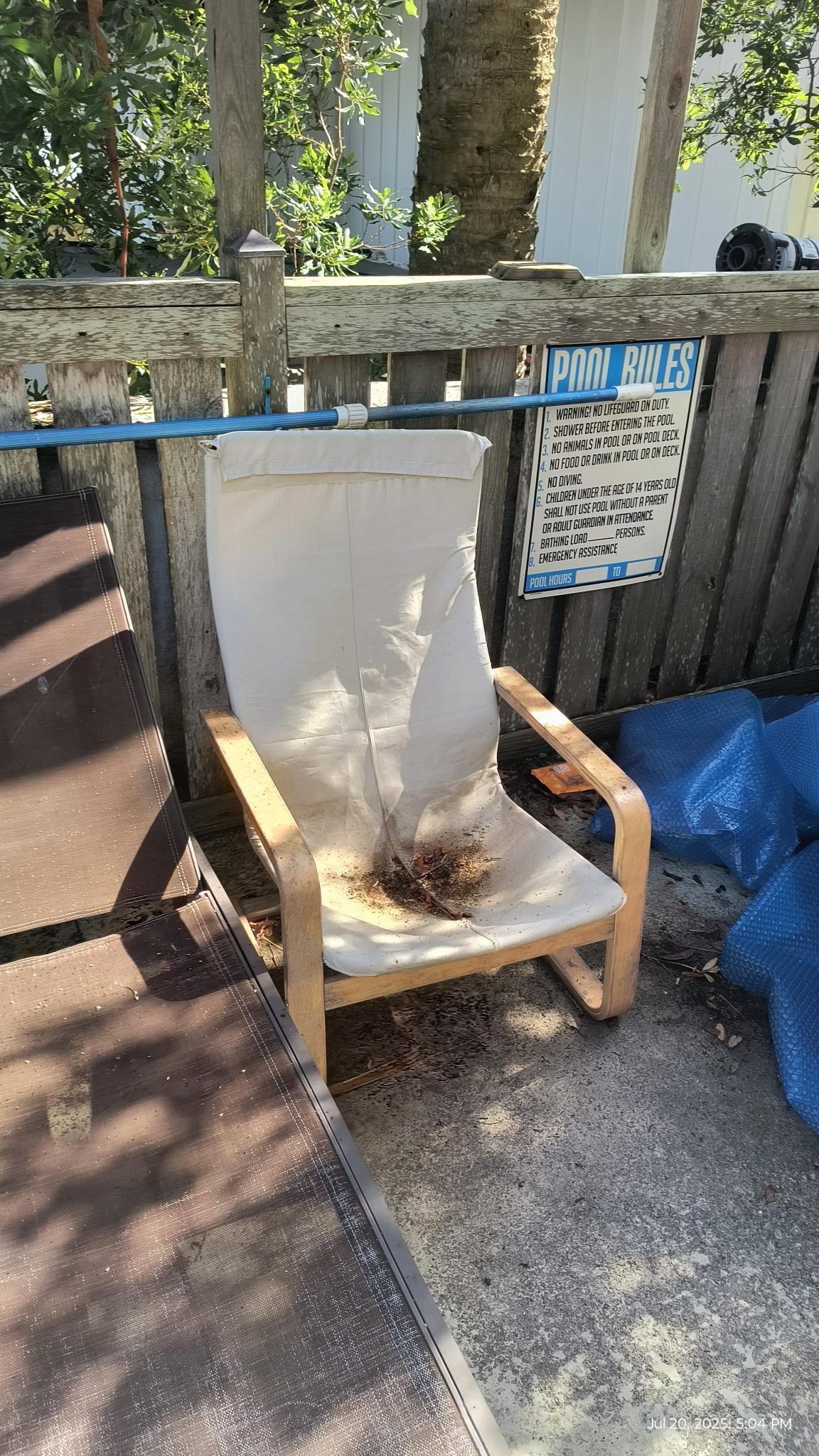 Dirty chairs around pool