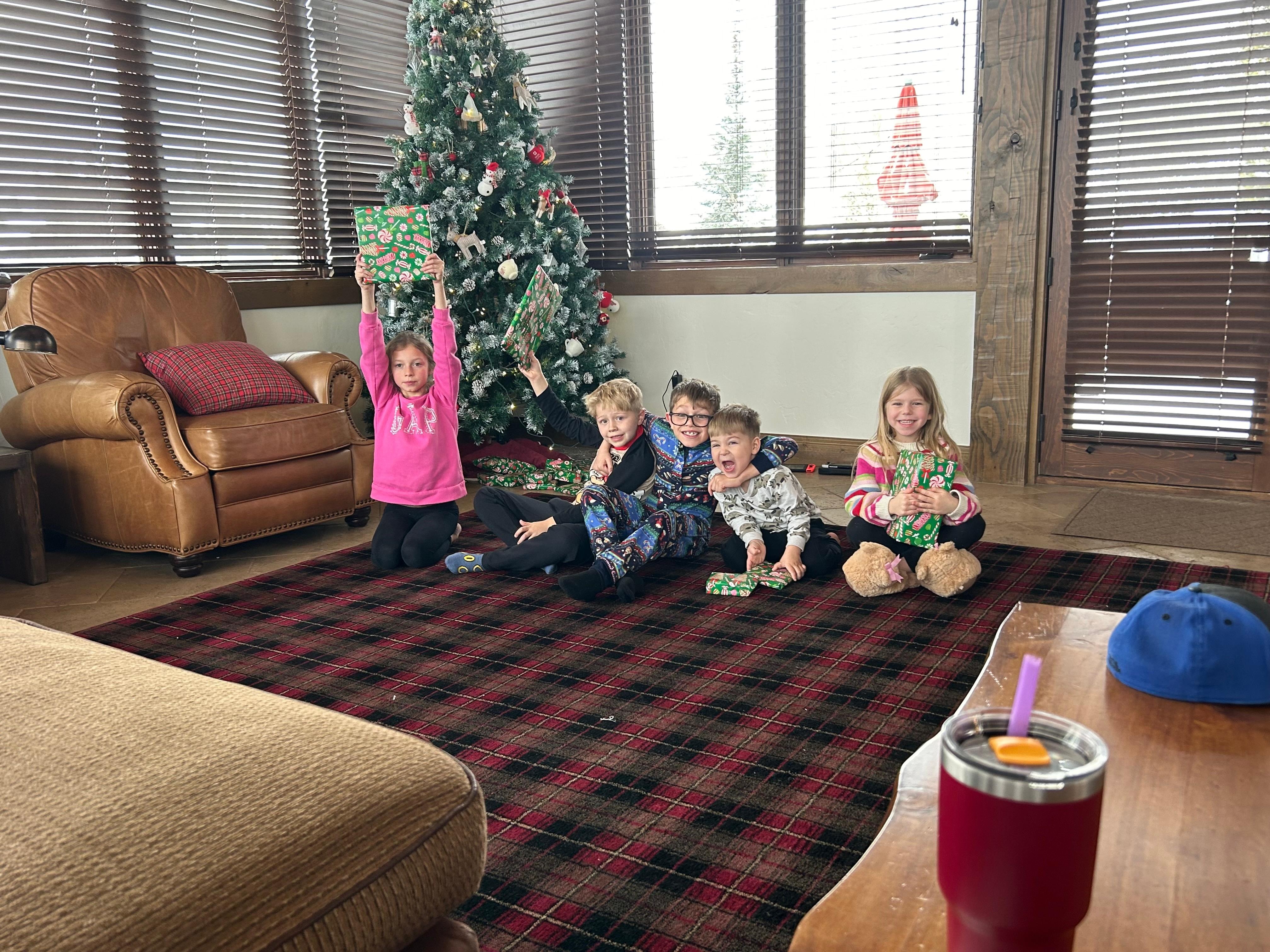 The grandkids had a blast opening present presents under the Christmas tree